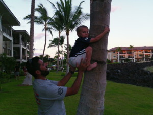 a man holding a child on a tree