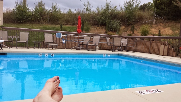 a person's feet in a pool