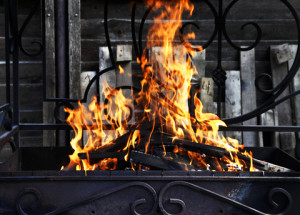 a fire burning in a grill