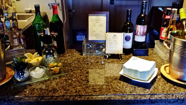 a table with bottles of wine and menus