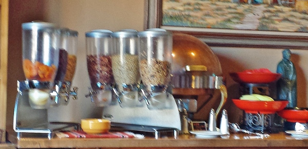 a group of cereal dispensers on a table