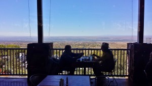 a couple of men sitting at a table