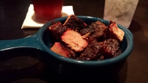 a bowl of meat on a table
