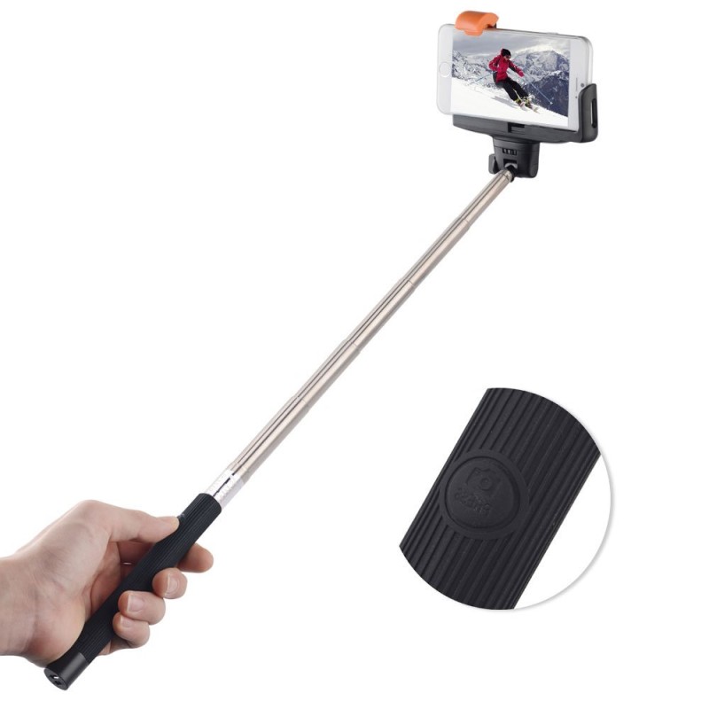 a selfie stick with a person on a ski slope