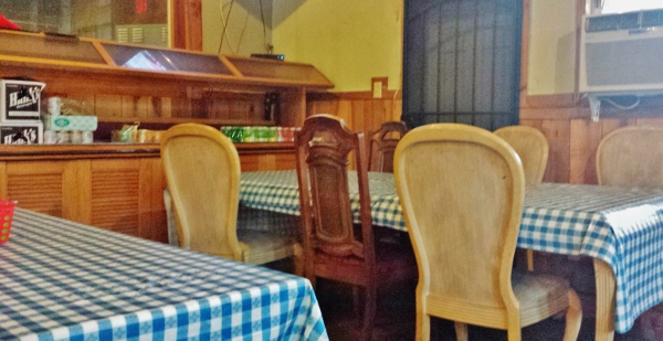 a table with checkered tablecloth in a restaurant