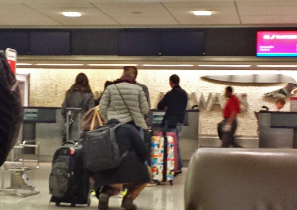 people with luggage in a airport