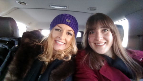 two women taking a selfie in a car