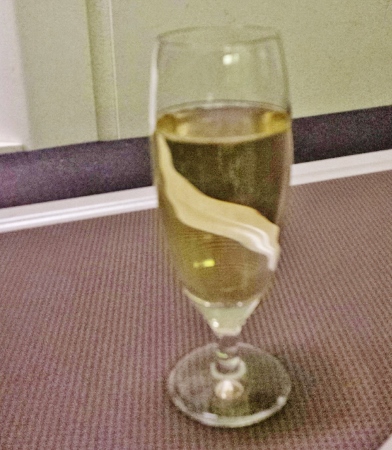 a glass of champagne on a table