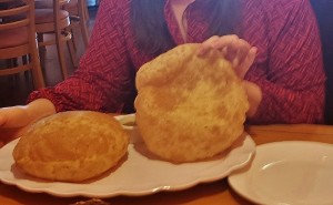 a person holding a plate of food
