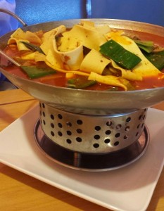 a bowl of soup on a plate