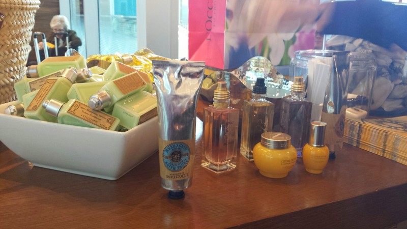 a group of bottles of perfume and other items on a table