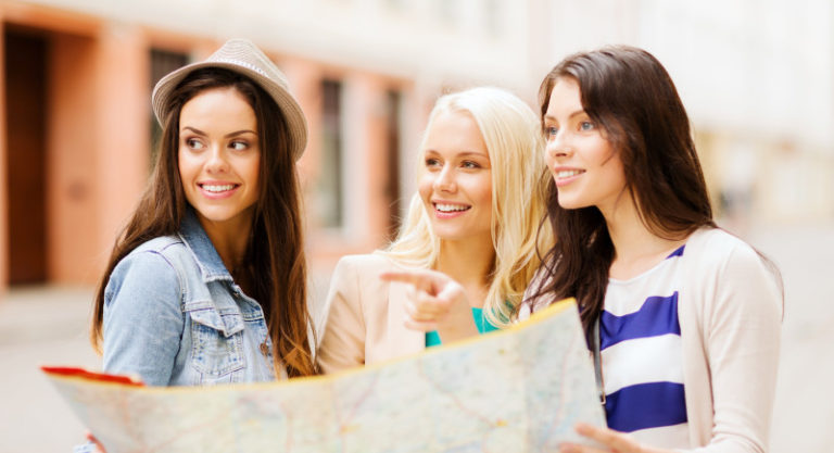 a group of women looking at a map