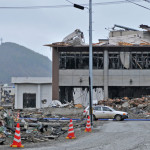 a building with debris on the ground