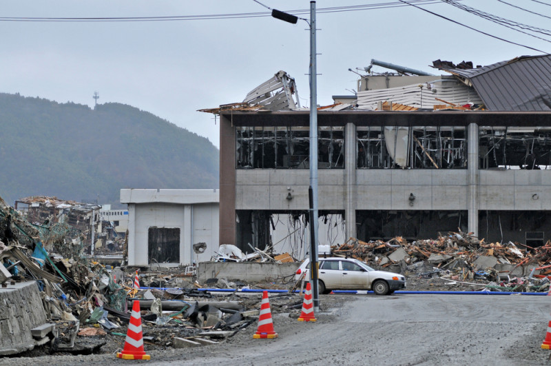 a building with debris on the ground