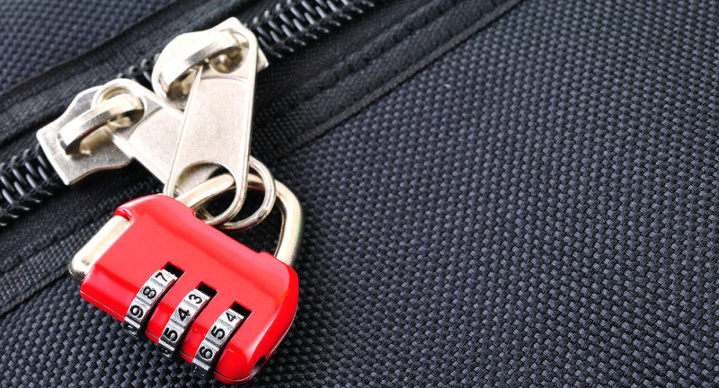 a red lock on a zipper