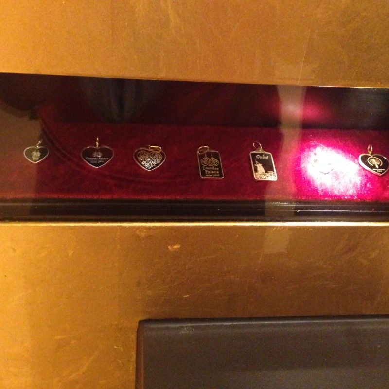 a group of pendants on a red surface
