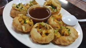 a plate of food with a spoon