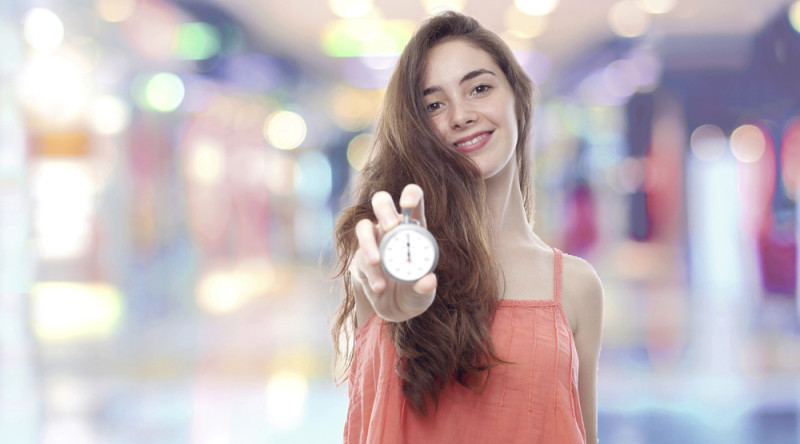 a woman holding a stopwatch