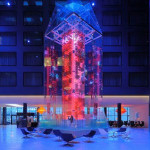 a glass tower with red lights