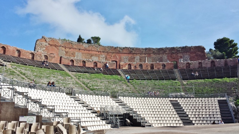 an empty amphitheater with white seats