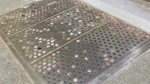 a metal grate with holes