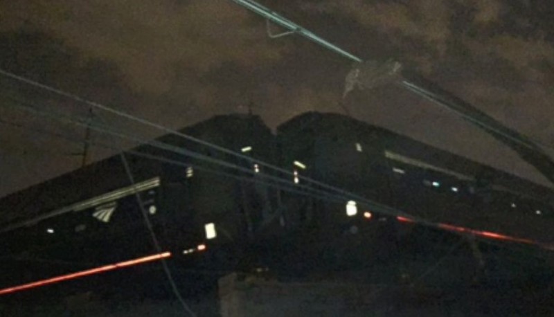 a train at night with wires coming out of it