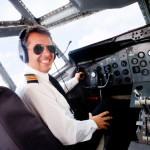 a man in a pilot's cockpit