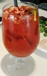 a glass with a drink and a straw