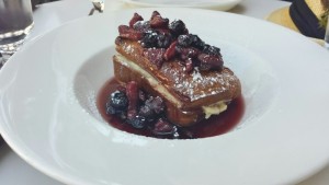a plate of food with fruit on top