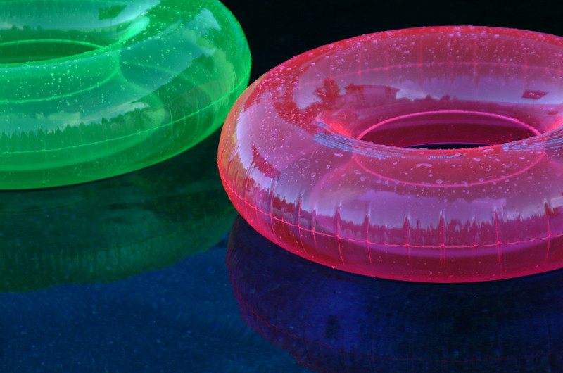 a pair of floating tubes in water