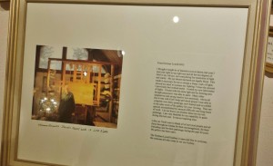 a framed picture of a man in a workshop