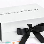 a white box with a black bow