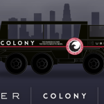 a black vehicle with a city behind it