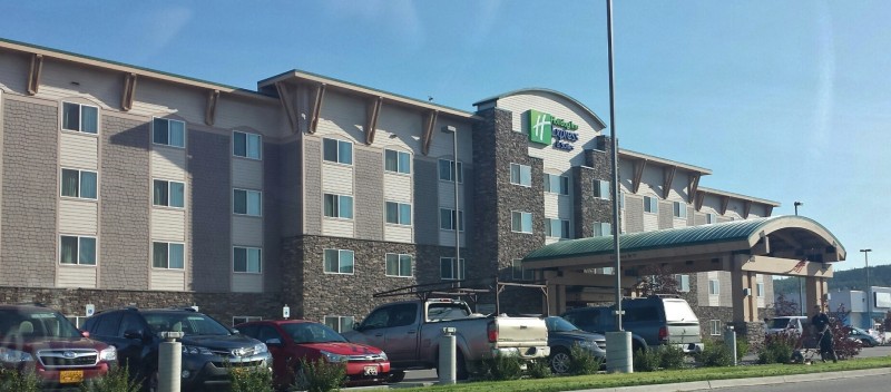 a building with cars parked in front of it