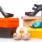 a group of shoes on top of boxes