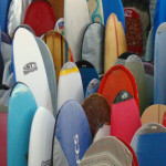 a group of surfboards in a store