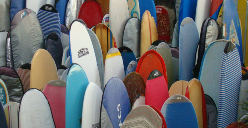a group of surfboards in a store