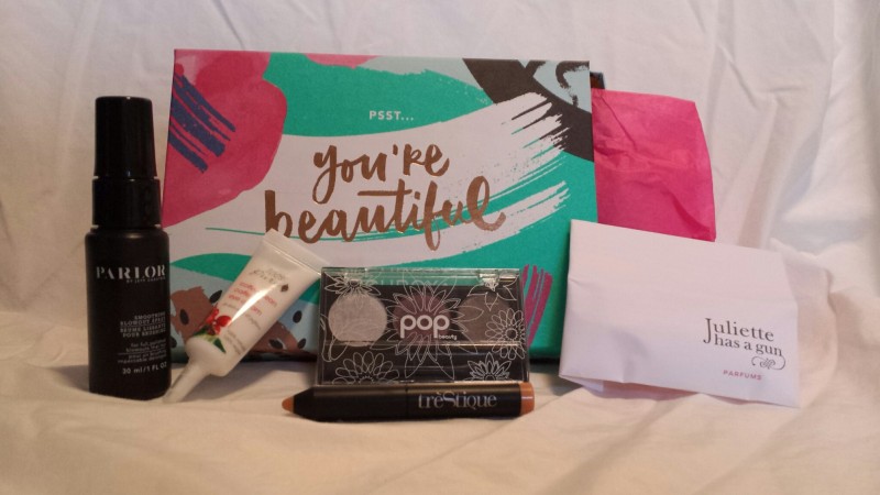 a box with a makeup product and a tube of cream