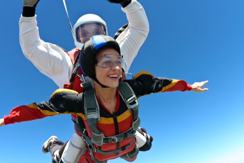 a man and woman skydiving