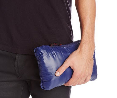 a man holding a blue bag