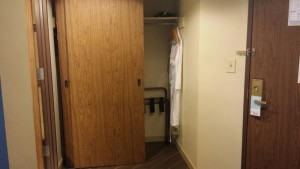 a closet door with a wooden door