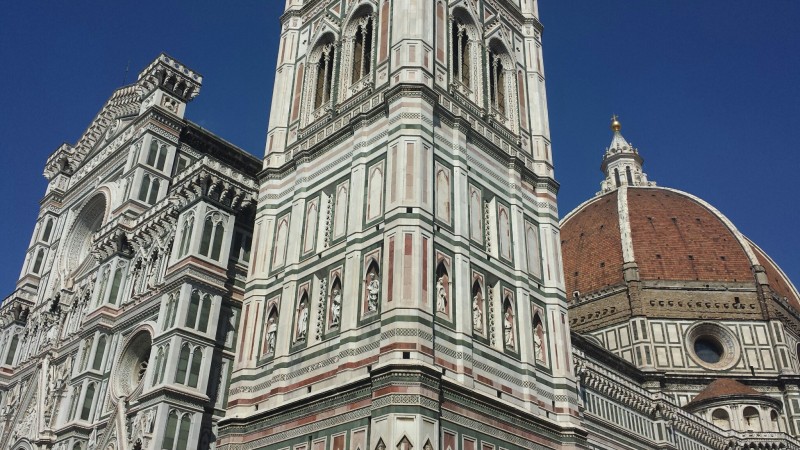 a tall building with Florence Cathedral