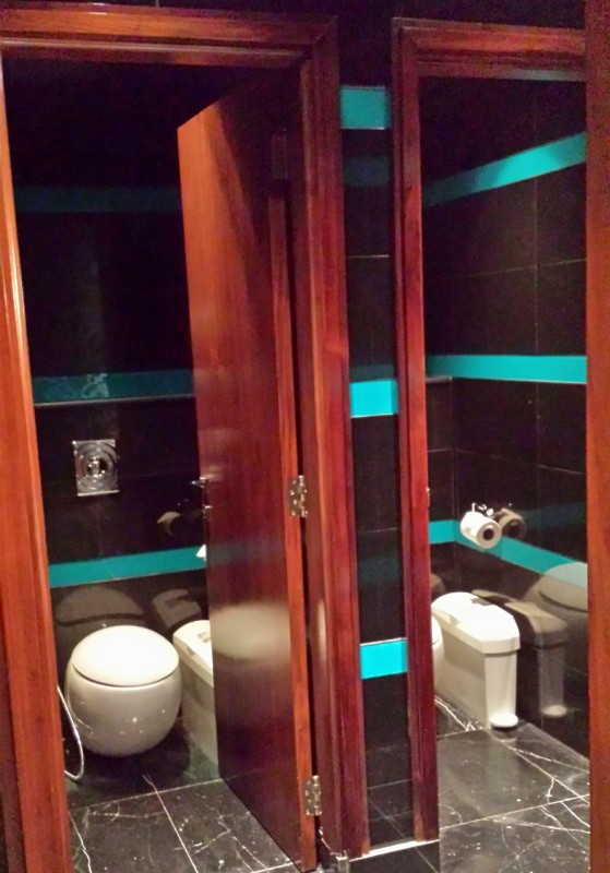 a bathroom with a glass door