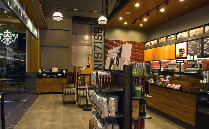 a store with shelves of coffee and drinks