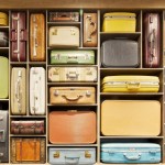 a shelf full of suitcases
