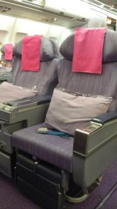 a row of seats with pink towels from the top