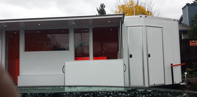a white trailer with windows