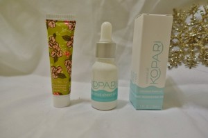 a group of small bottles and a tube of cream