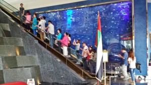 a group of people on an escalator