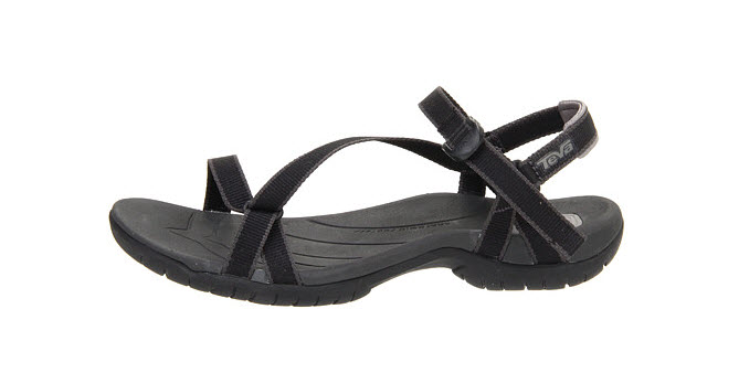 a black sandal with a strap